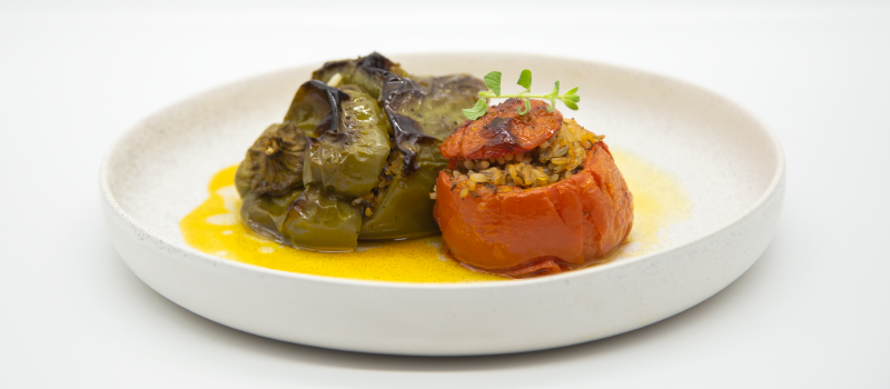 Tomatoes and peppers stuffed with rice, with ILIADA Kalamata PDO Extra Virgin Olive Oil