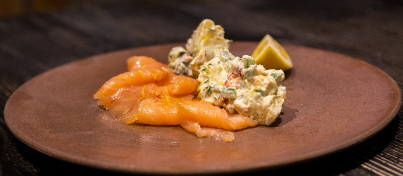 Potato salad and smoked salmon with ILIADA spray Kalamata PDO Extra Virgin Olive Oil - thumb image