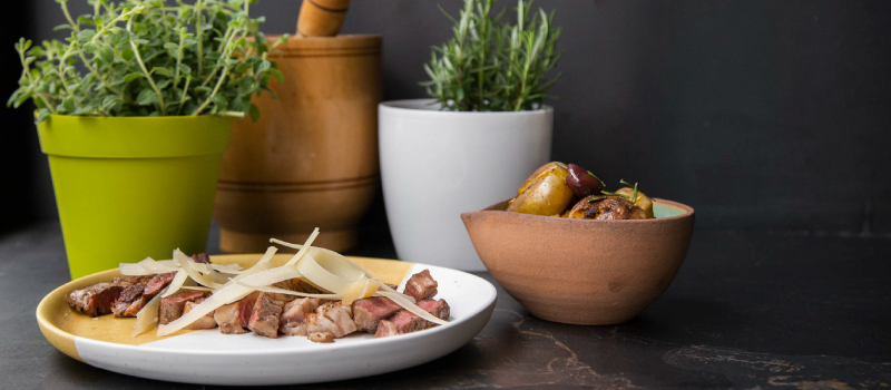 Ribeye tagliata and baby potatoes with ILIADA Organic Kalamata PDO Extra Virgin Olive Oil