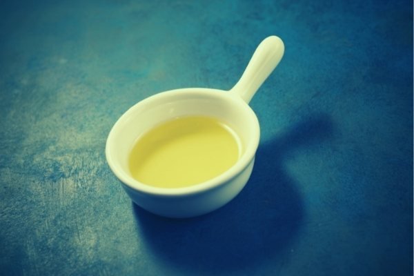olive oil in small drinking cup